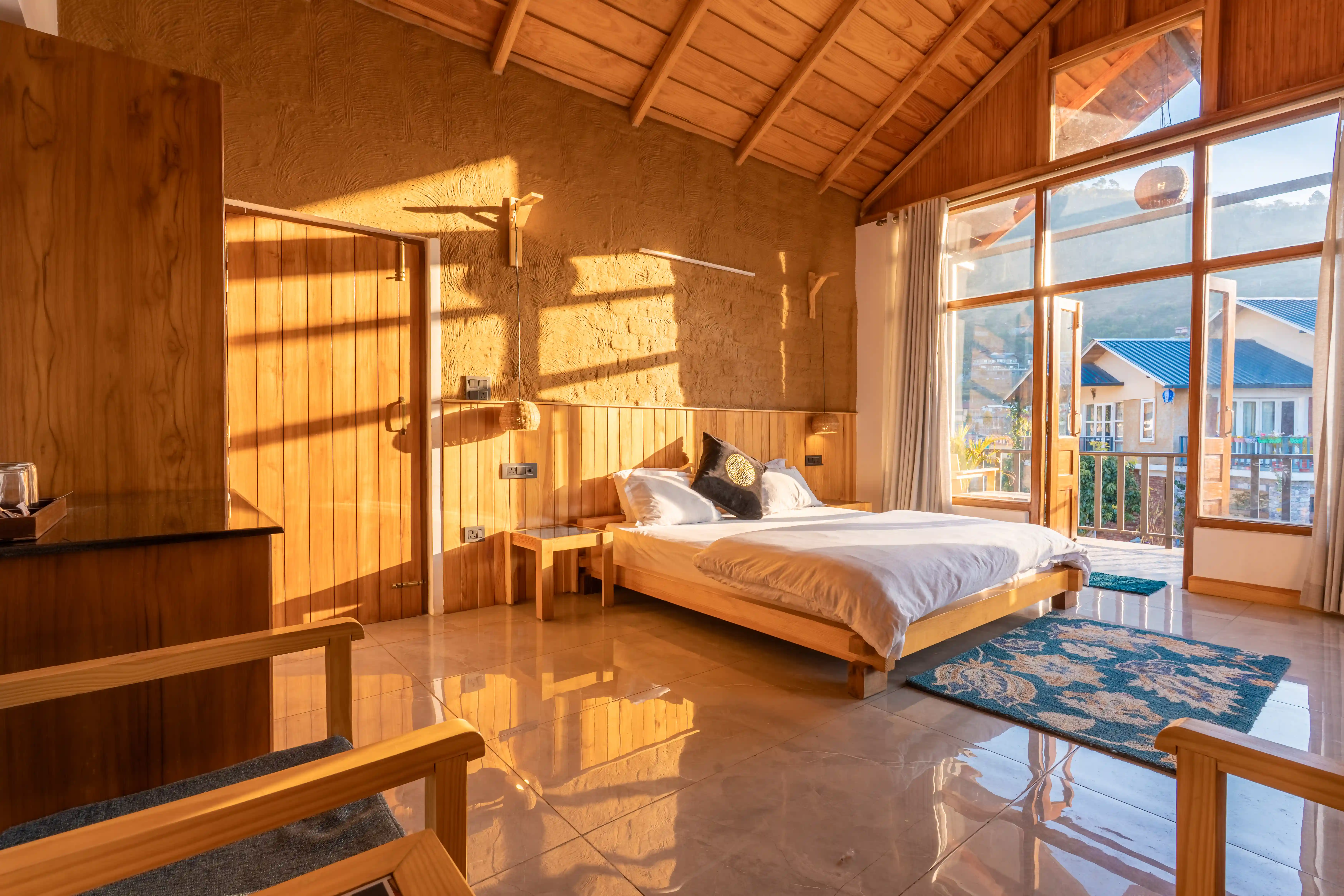 Traditional timber balconies overlooking Naukuchiatal pine hills